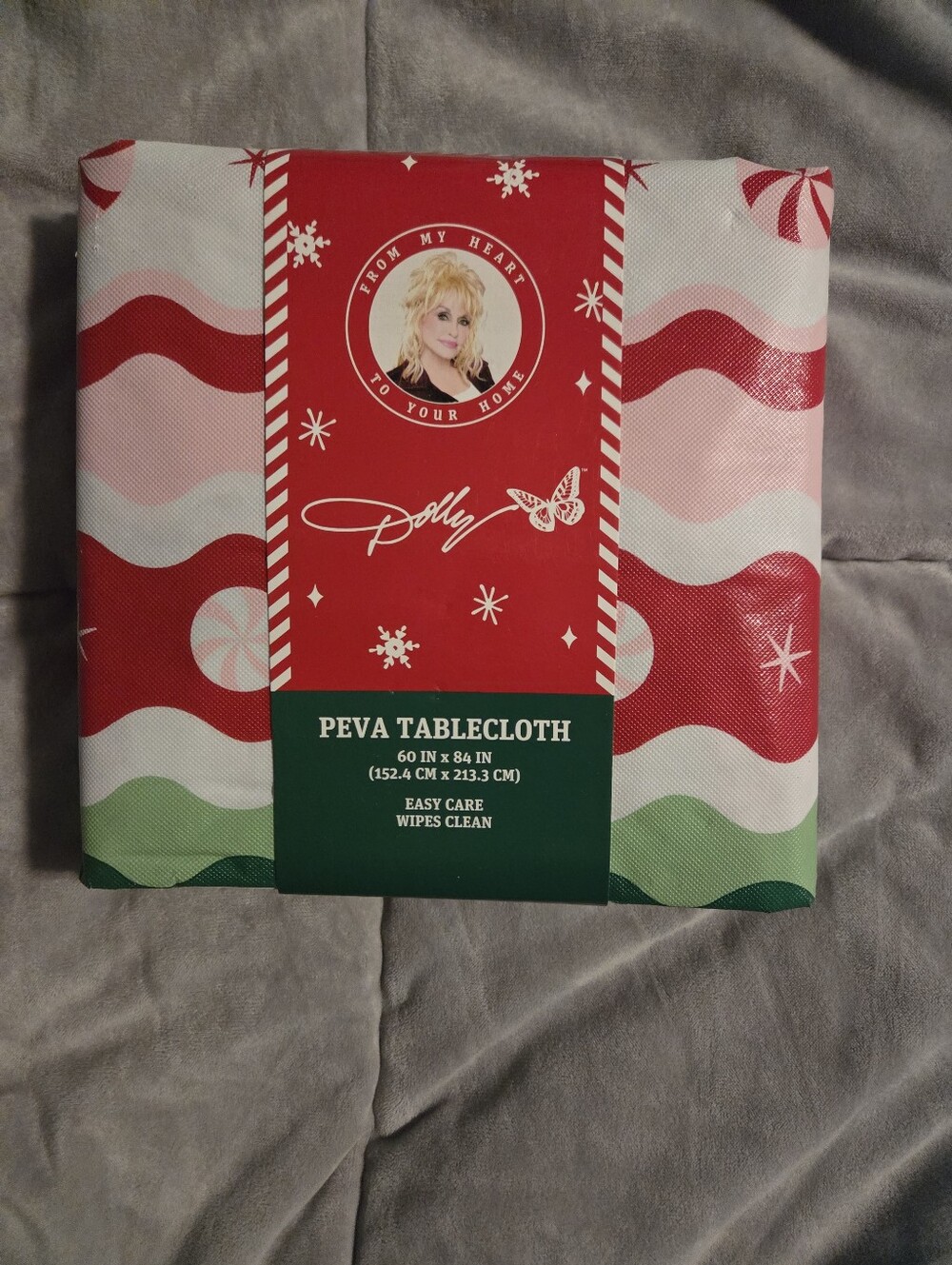 NWT DOLLY PARTON Christmas 60" x 84" Peva Tablecloth With Candy Canes. 60"X84"